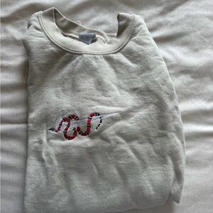Cream Nike Sweatshirt with Embroidered Red Snake Accent